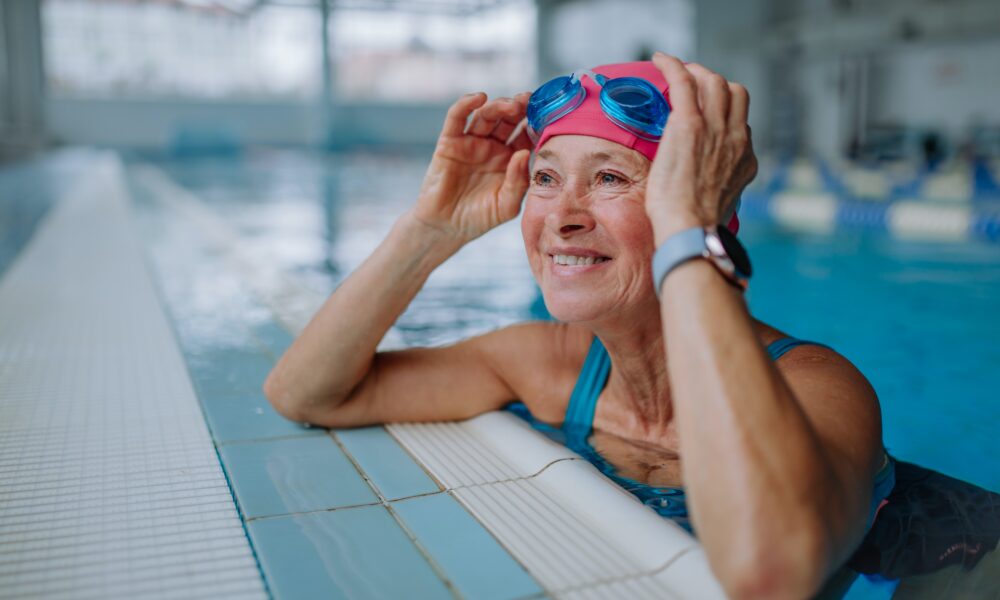 Senior in pool after swim